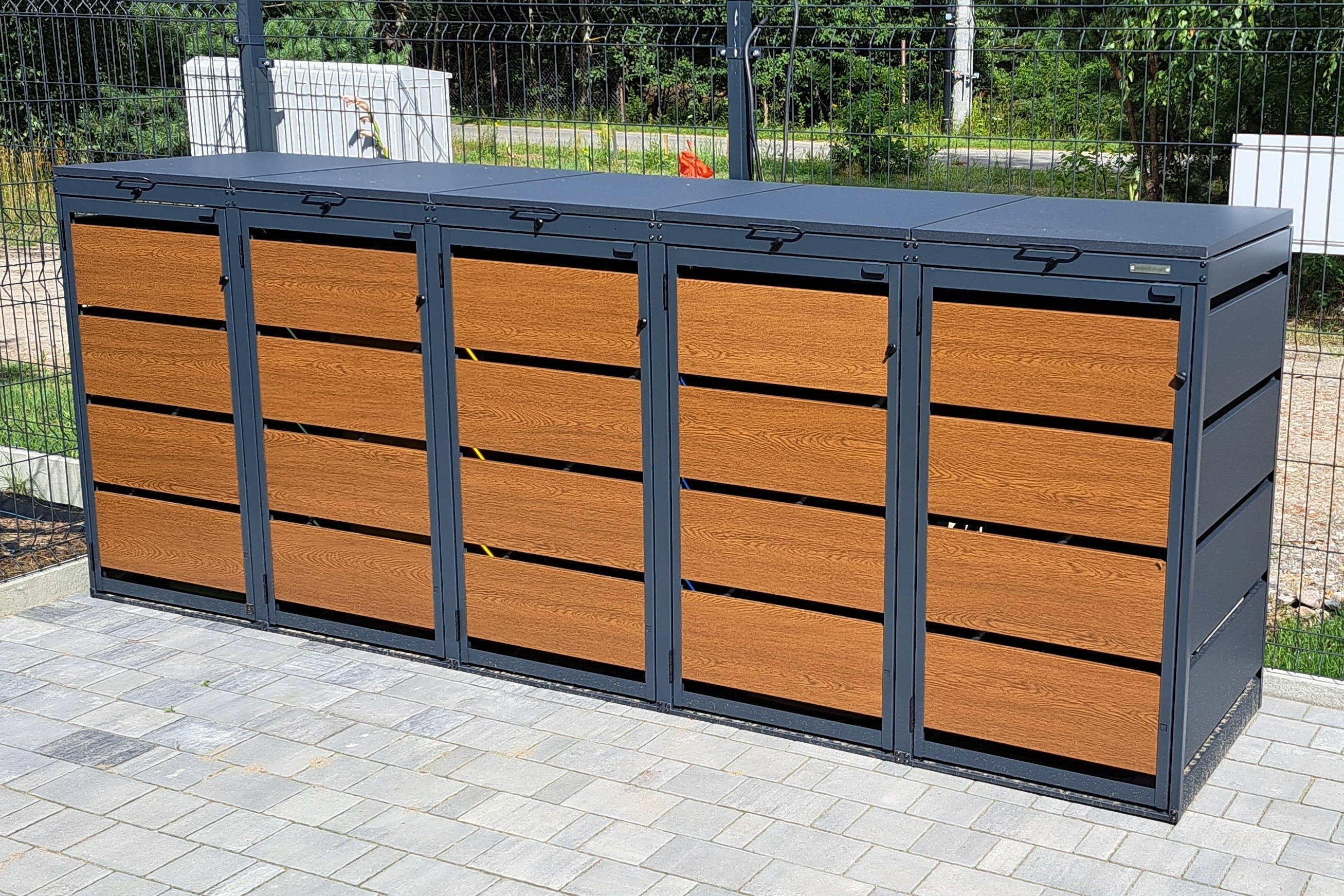 Protective box for wooden or metal waste bins with door.